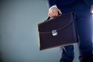 Diplomacy Isolated image of a businessman carrying a briefcase